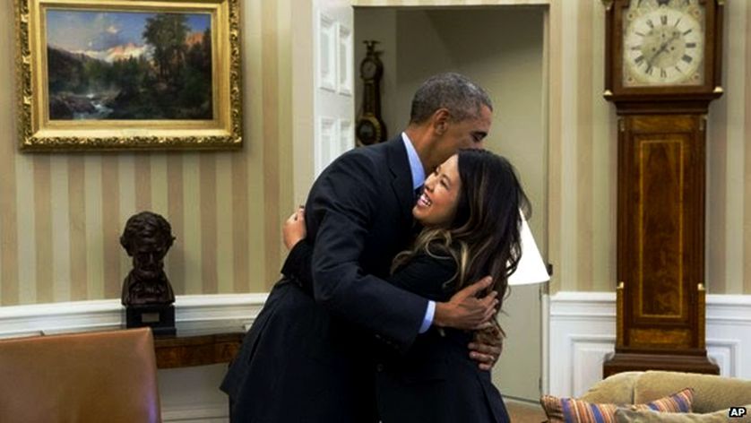 Nina Pham Health worker meets President Obama in the Oval Office after her successful 21 day isolation. (Photo Courtesy: AP)